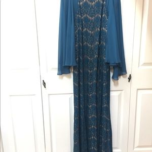 Betsy & Adam Teal Lace Gown Sheer Cape Sleeves
